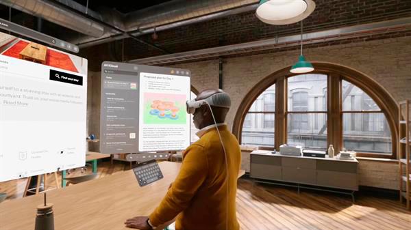 Una persona consultando páginas en una pantalla doble vista con unos Apple Vision Pro, las nuevas gafas de realidad virtual (VR) de la empresa. EFE/Apple