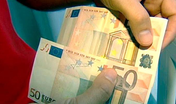 Dos detenidos en Sevilla por comprar cupones con billetes falsos de 50 euros 